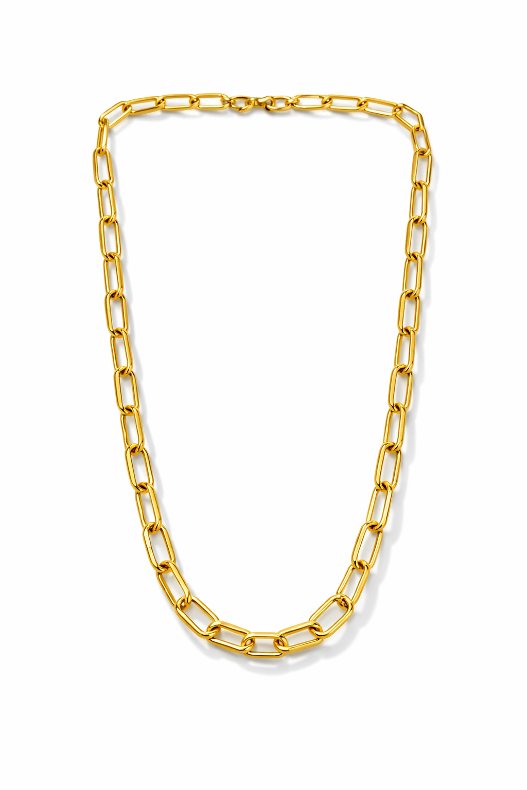 A gold paperclip chain necklace displayed in a U-shape against a clean white background.